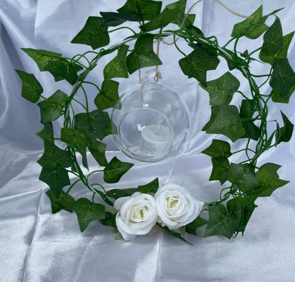Metal Floral Centrepiece with Ivy white roses transparent hanging sphere and LED candle