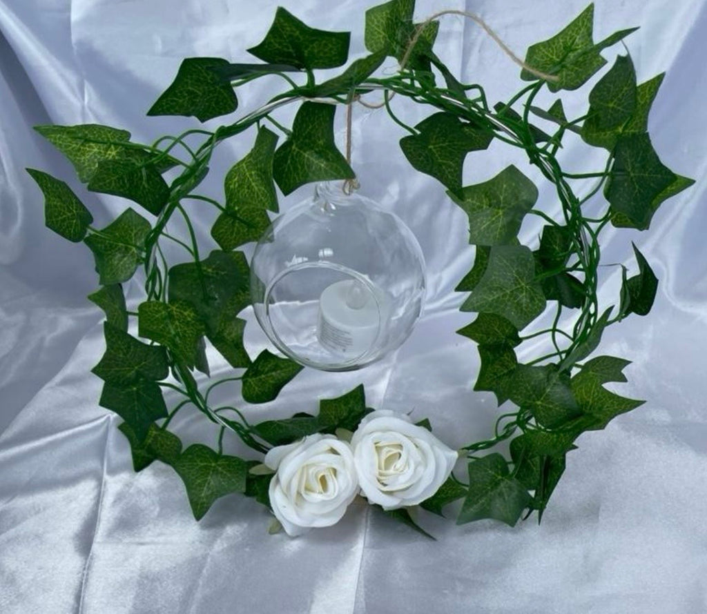 Metal Floral Centrepiece with Ivy white roses transparent hanging sphere and LED candle