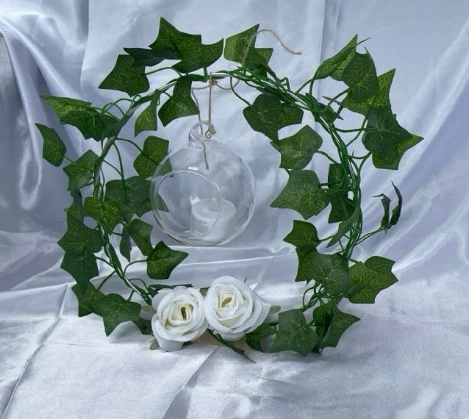 Metal Floral Centrepiece with Ivy white roses transparent hanging sphere and LED candle