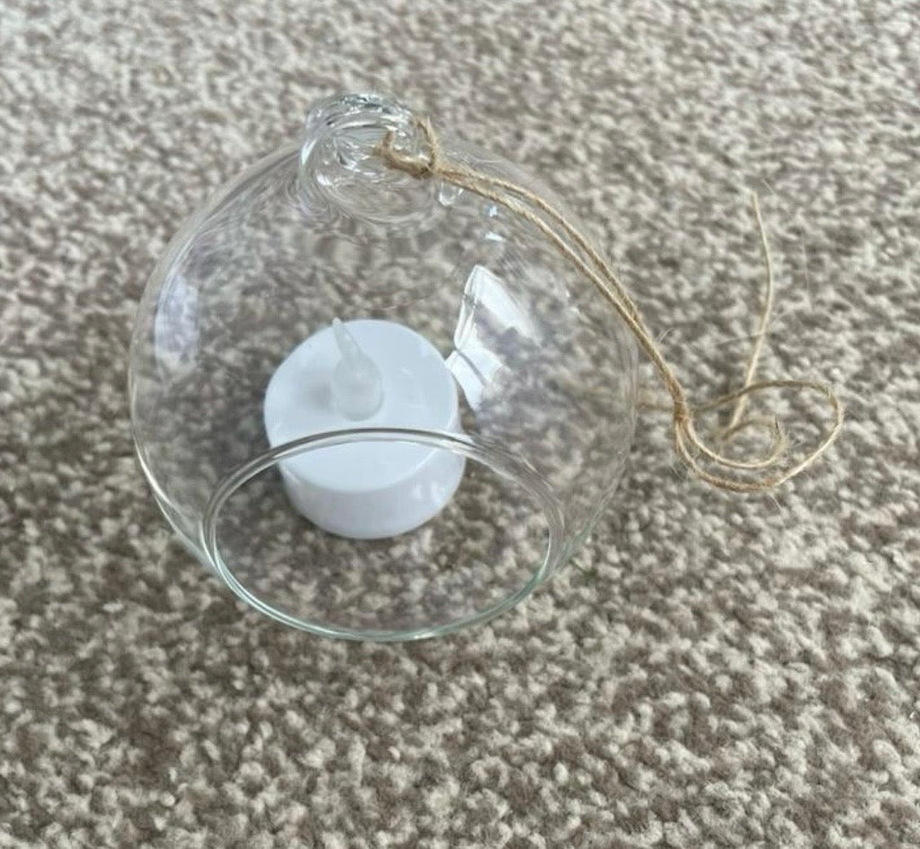 Metal Floral Centrepiece with Ivy white roses transparent hanging sphere and LED candle