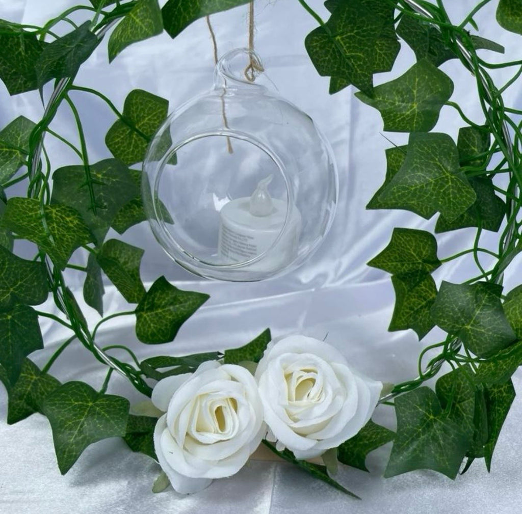 Metal Floral Centrepiece with Ivy white roses transparent hanging sphere and LED candle