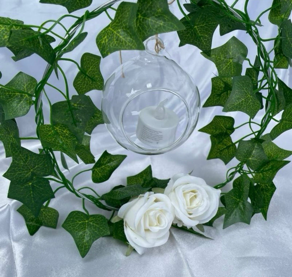 Metal Floral Centrepiece with Ivy white roses transparent hanging sphere and LED candle