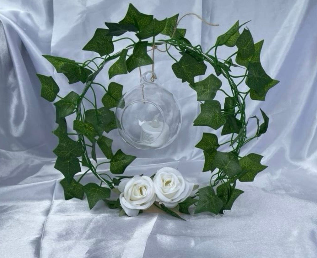 Metal Floral Centrepiece with Ivy white roses transparent hanging sphere and LED candle