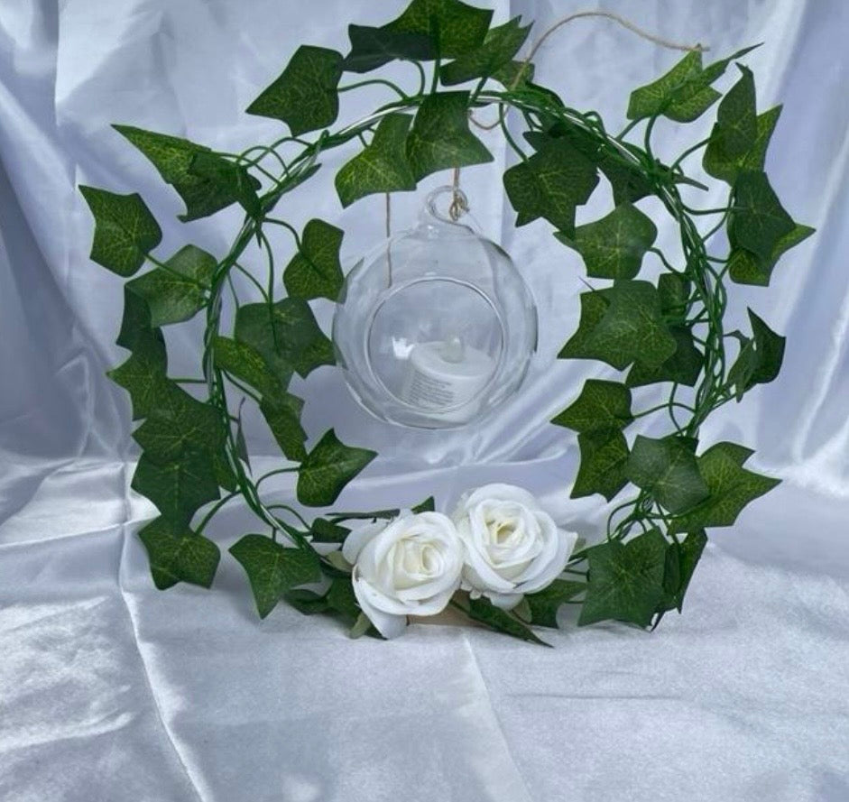 Metal Floral Centrepiece with Ivy white roses transparent hanging sphere and LED candle